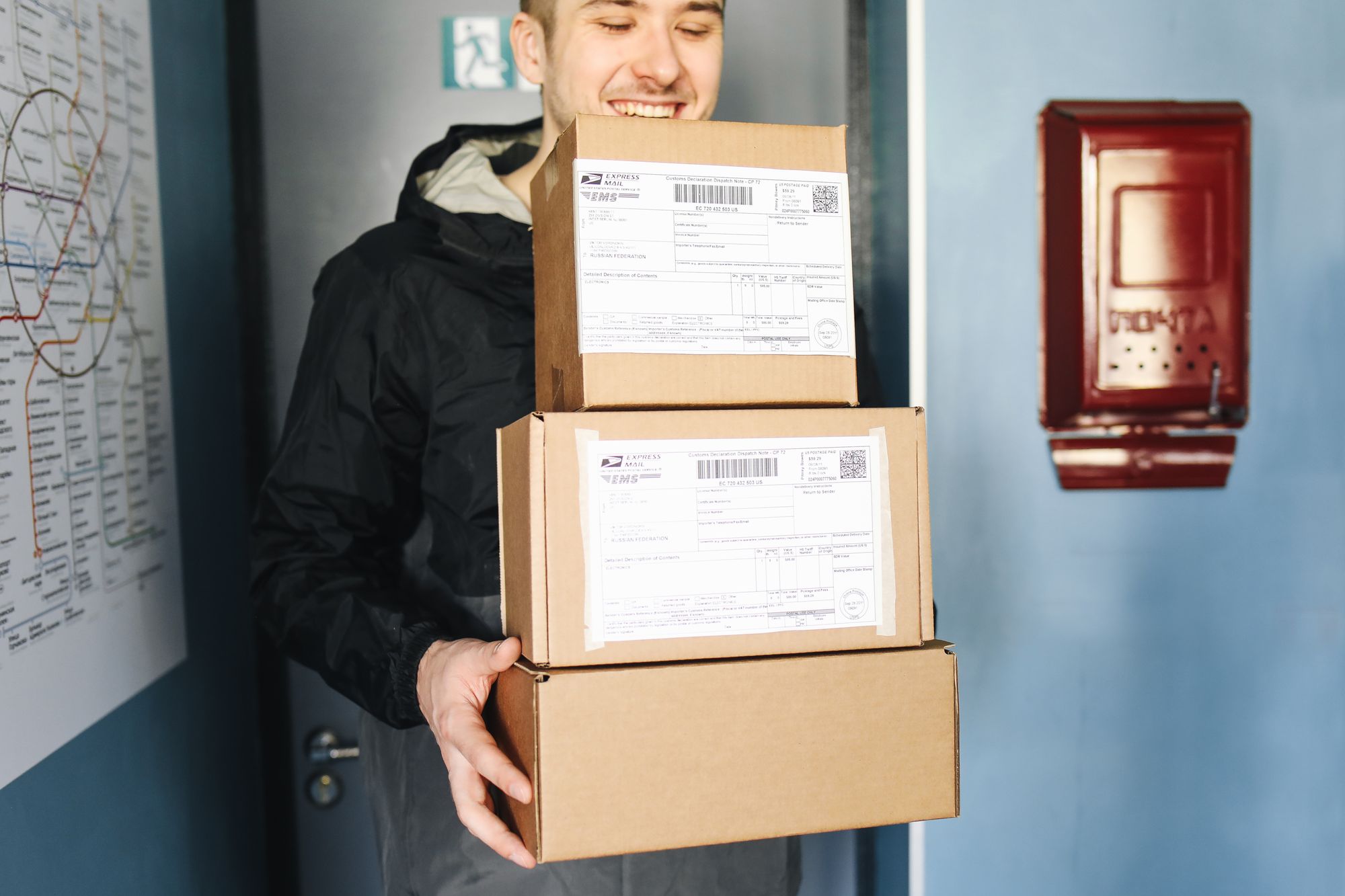 Delivery team unloading parcels from a van